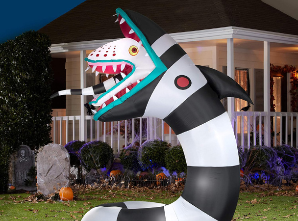 Sandworm inflatable in nighttime yard display