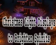Drone photo of Christmas Light Displays at snowy suburban cul-de-sac at night with five houses decorated in colorful Christmas lights on roofs and trees.