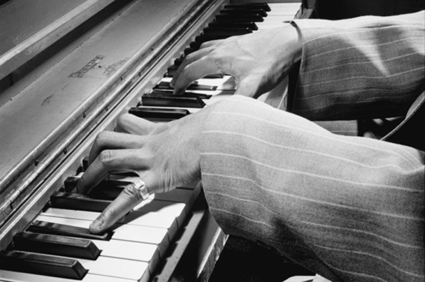 Nat King Cole listening to playback