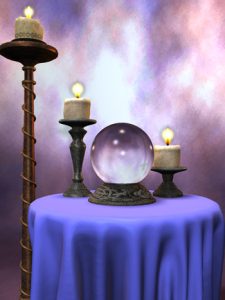 Crystal balls on a table with candles – collecting fortune teller items