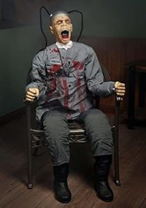 Death Row Animatronic in full prisoner outfit strapped into execution setup