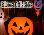 Halloween Inflatables glowing in a decorated front yard at night