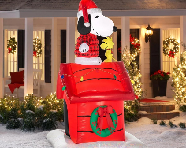 Nighttime yard display of 8 FT Snoopy on Doghouse Christmas Inflatable