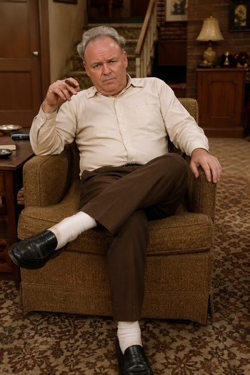 DIY Archie Bunker Costume with off white shirt, brown pants, white socks, black shoes