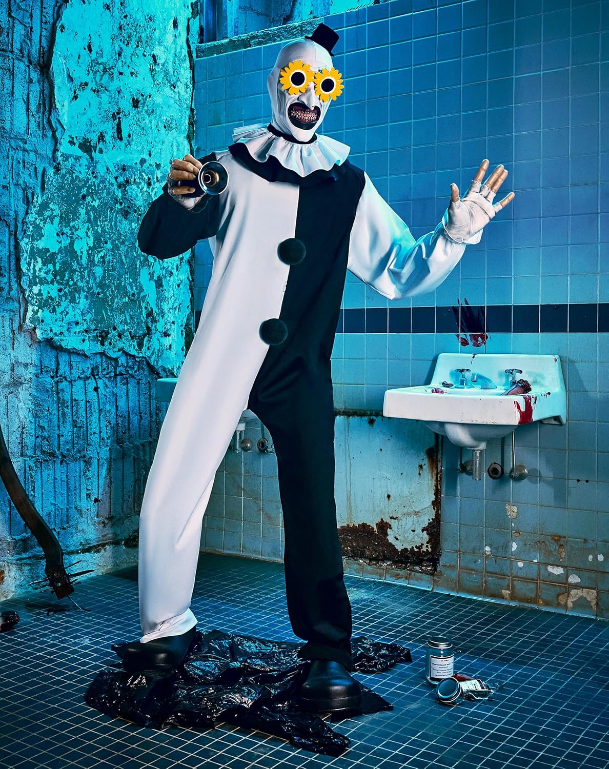Art The Clown Animatronic in darkened Halloween display with waving hand motion active