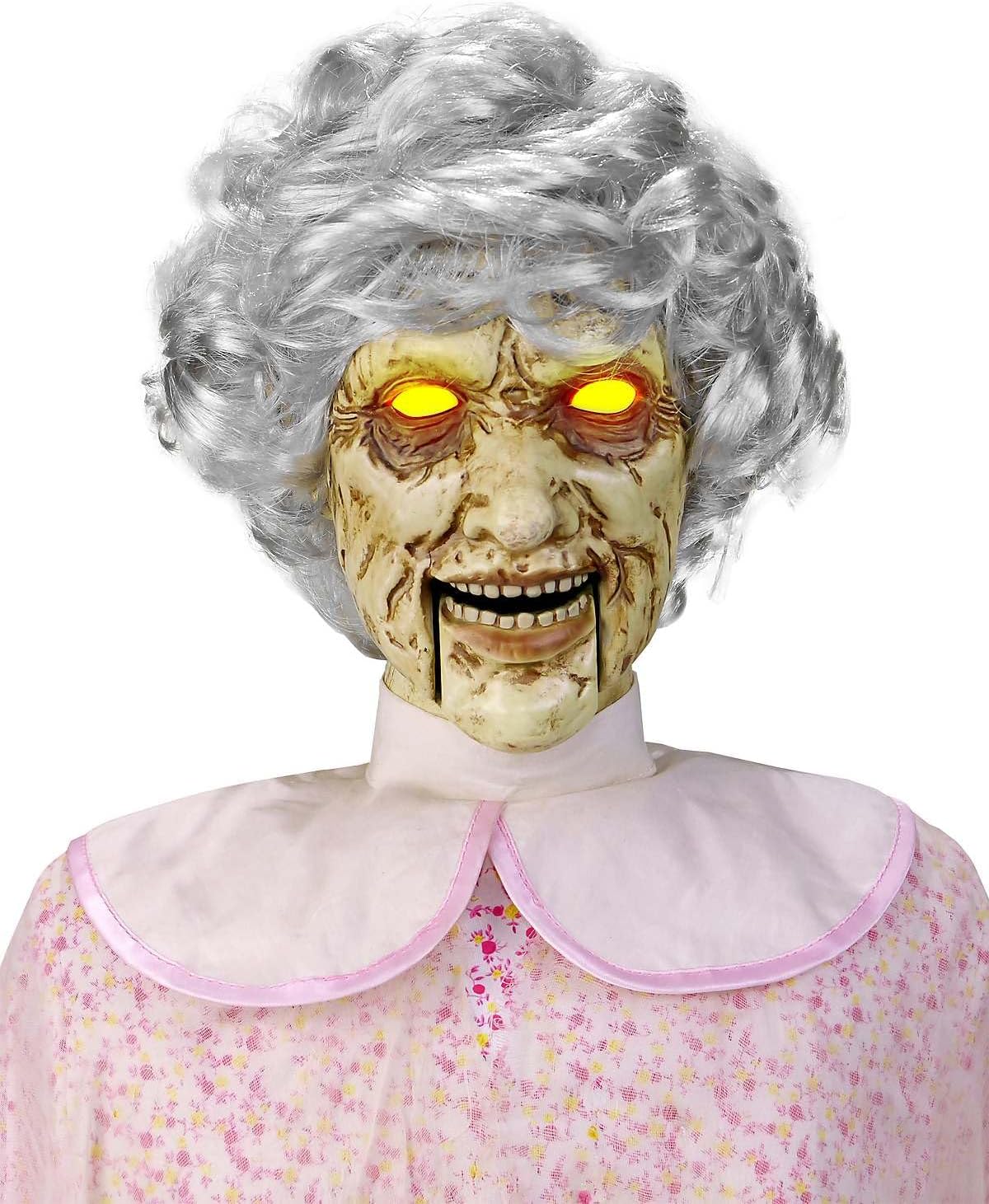 Twisted Grandma Animatronic in darkened indoor Halloween display with glowing eyes active