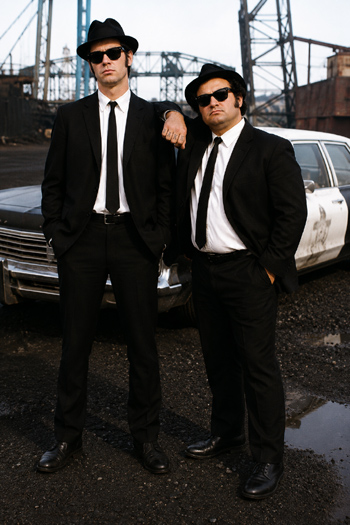 DIY Blues Brothers costume with black suits Ray-Ban sunglasses black fedoras skinny ties and JAKE ELWOOD knuckle lettering