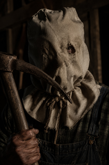 DIY Jason Voorhees Costume with burlap sack and denim overalls