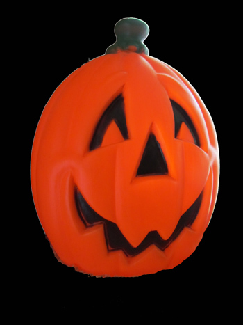 Vintage Halloween Collectibles featuring a classic blow mold jack-o'-lantern that has become a favorite decoration among Halloween collectors.