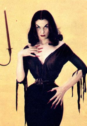 Vampira in her iconic black dress and gothic makeup, one of television’s earliest local horror hosts.