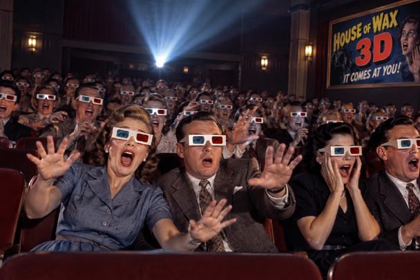 1950s theater audience wearing 3D glasses while watching House of Wax 3D