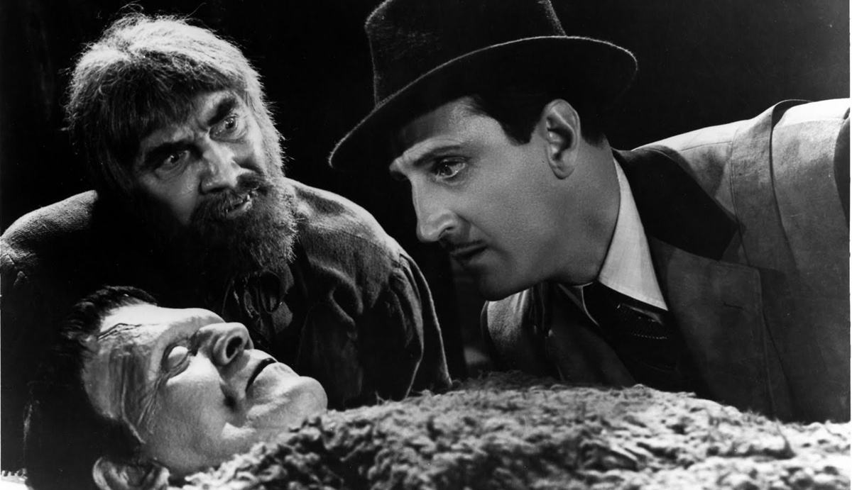 Son of Frankenstein Review featuring the three legendary stars of the 1939 horror classic, Boris Karloff, Basil Rathbone, and Bela Lugosi, in a dramatic black-and-white portrait.